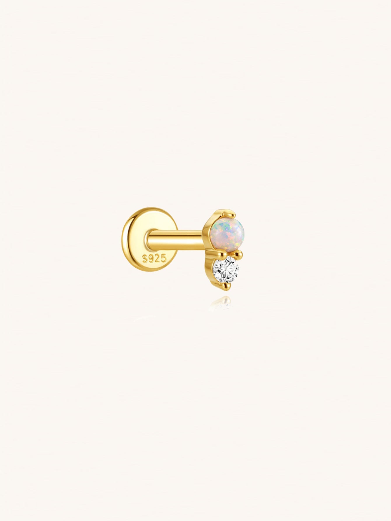 925 sterling silver opal and cubic zirconia flat back earring on beige background