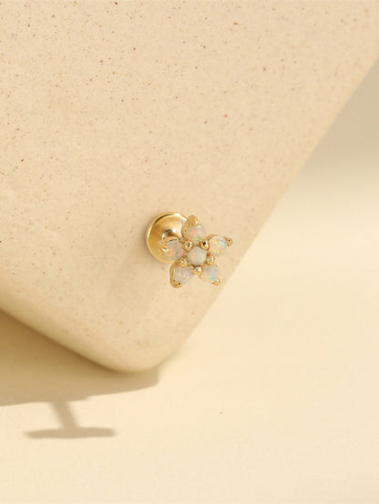 Close-up of 925 sterling silver opal flower flat back piercing jewelry