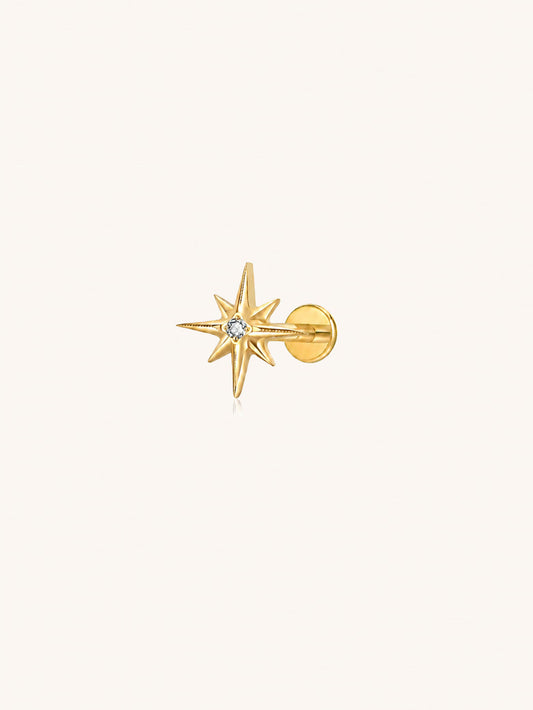 Gold G23 titanium starburst flat back stud with clear zirconia for helix lobe and cartilage piercings