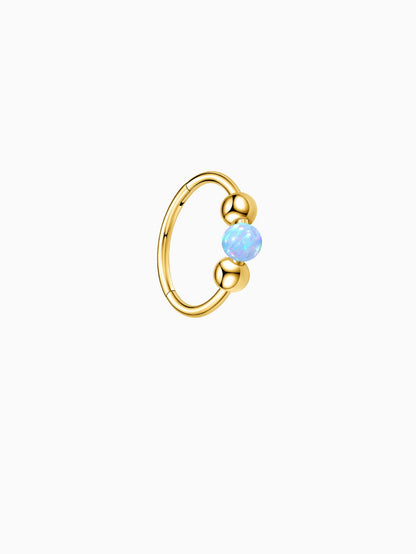 Gold G23 titanium seamless clicker ring with light blue opal bead and polished ball details