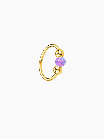 Gold G23 titanium seamless clicker ring with vibrant purple opal bead and smooth ball details