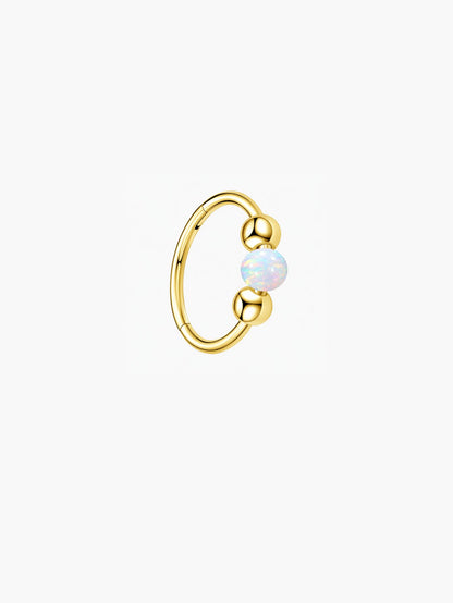 Gold G23 titanium clicker hoop with luminous white opal bead for cartilage and ear piercings