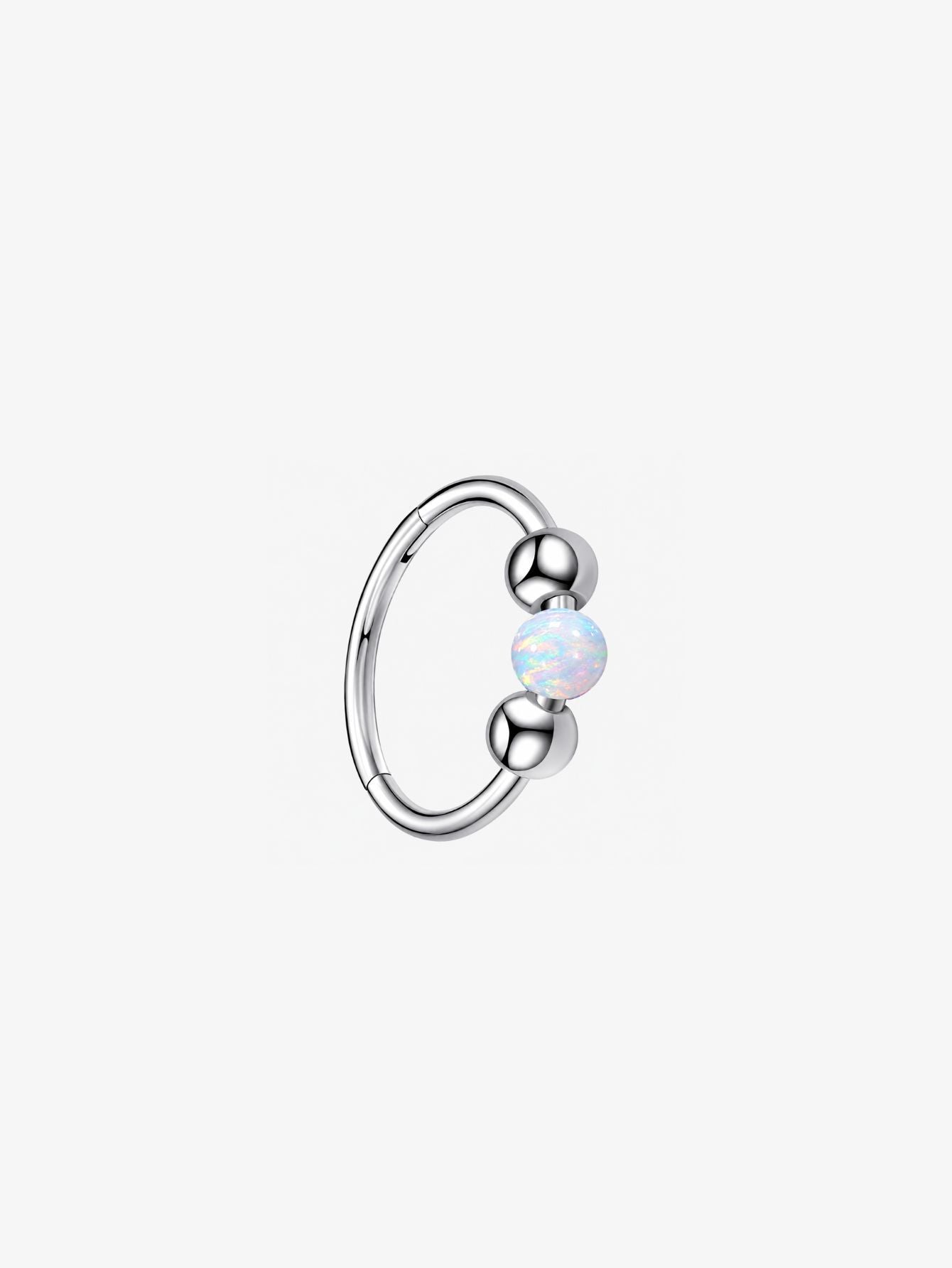 Silver G23 titanium seamless clicker ring featuring an iridescent white opal center bead