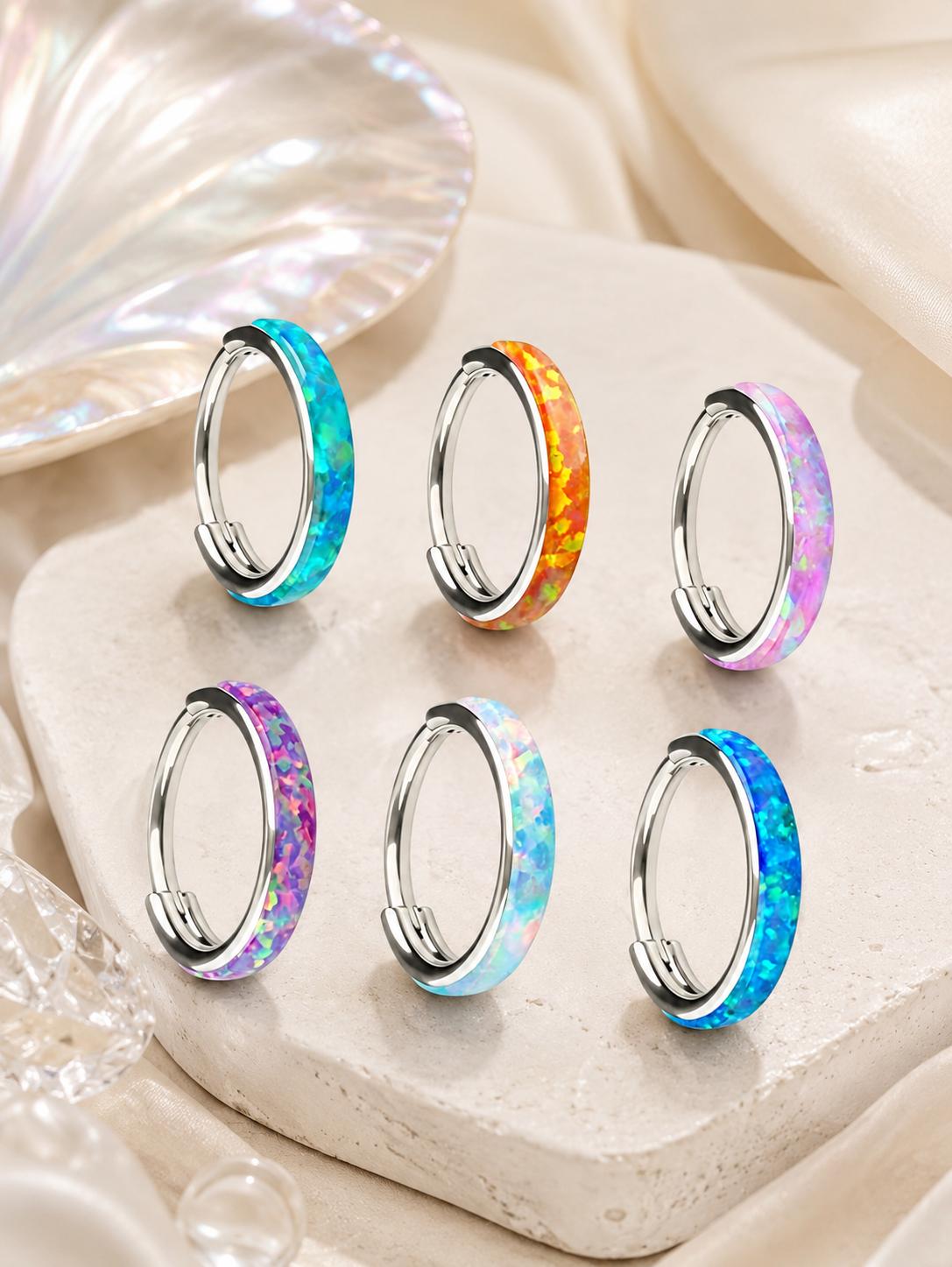 Aurora opal G23 titanium clicker hoop collection displayed in six colorful finishes.