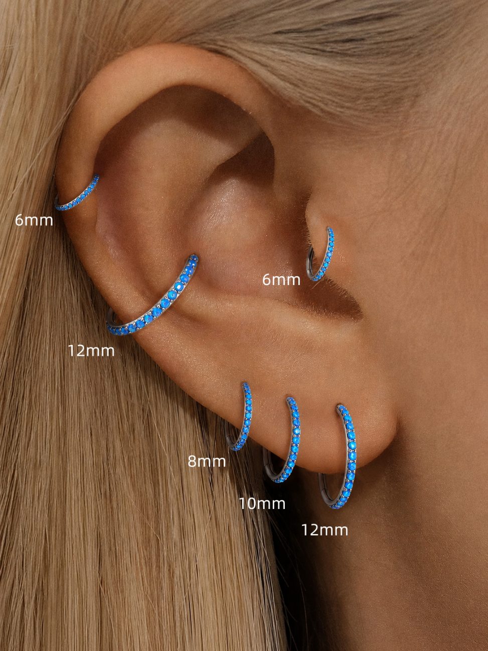 Blue opal clicker ring size comparison showing 6mm 8mm 10mm and 12mm on the ear