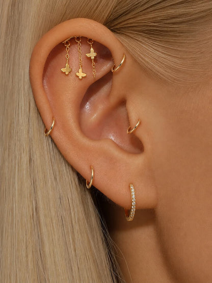 Butterfly hidden helix stud worn on the upper ear with delicate dangling chains