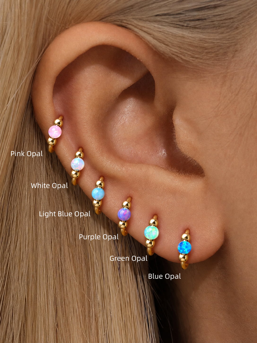 G23 titanium opal seamless clicker rings shown in six colors including pink, white, light blue, purple, green and blue opal