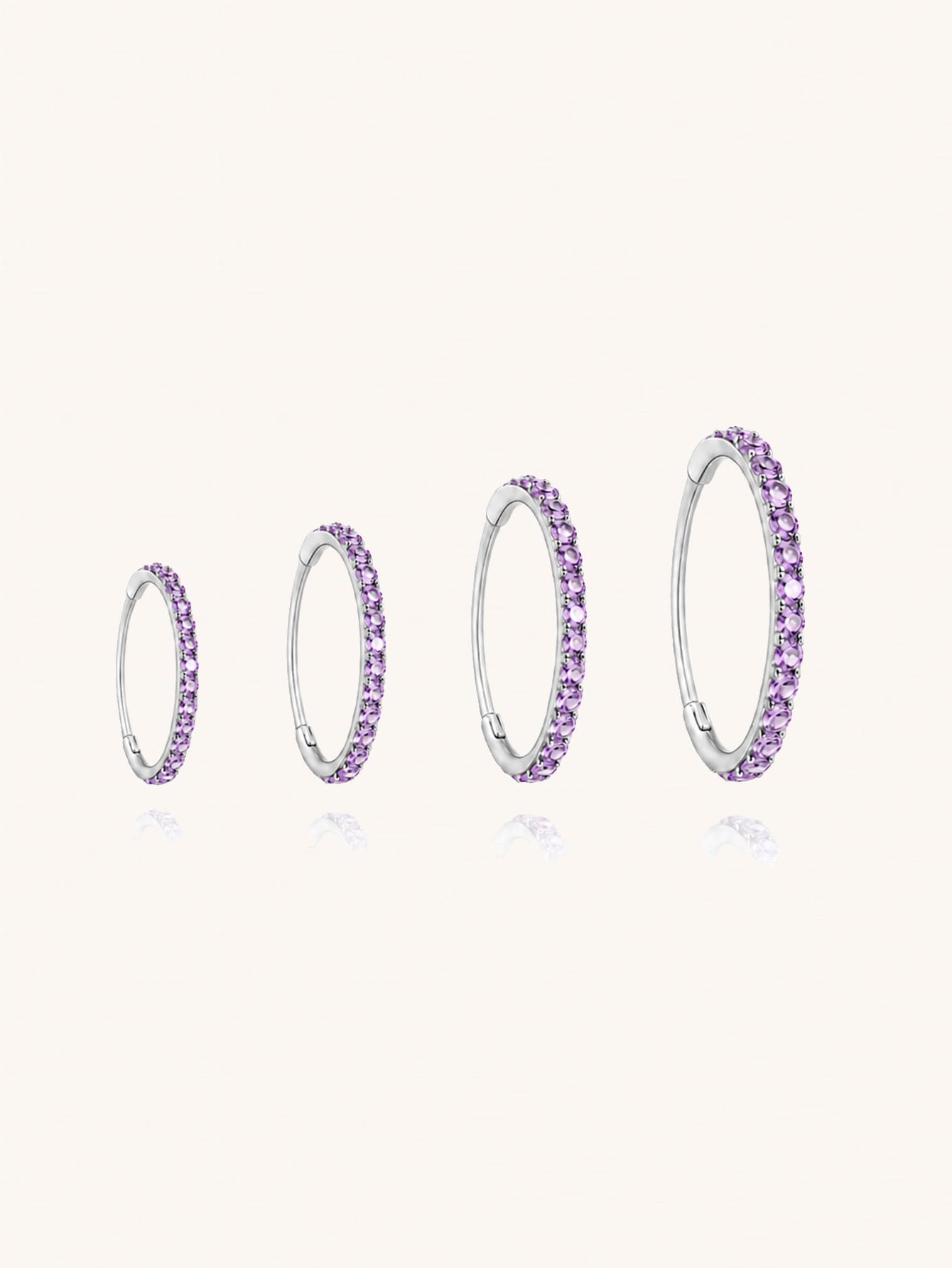 G23 titanium purple zirconia clicker hoop shown in 6mm 8mm 10mm and 12mm inner diameter sizes
