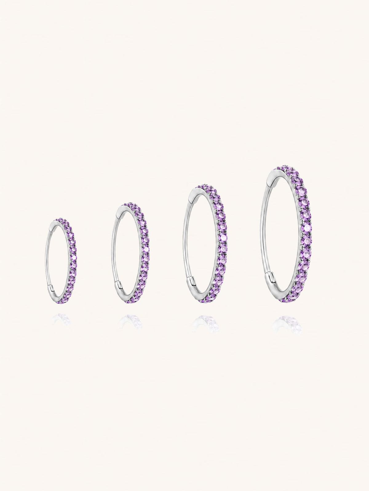 G23 titanium purple zirconia clicker hoop shown in 6mm 8mm 10mm and 12mm inner diameter sizes