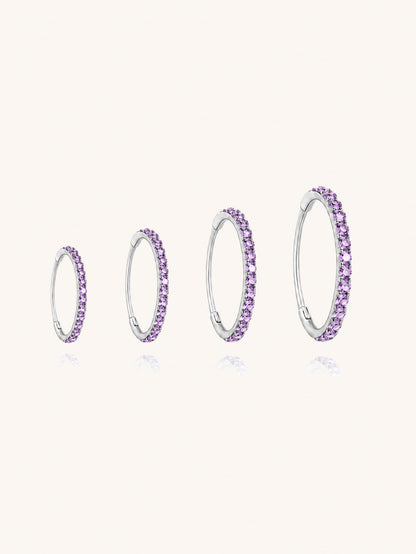 G23 titanium purple zirconia clicker hoop shown in 6mm 8mm 10mm and 12mm inner diameter sizes