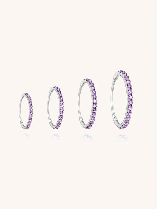 G23 titanium purple zirconia clicker hoop shown in 6mm 8mm 10mm and 12mm inner diameter sizes