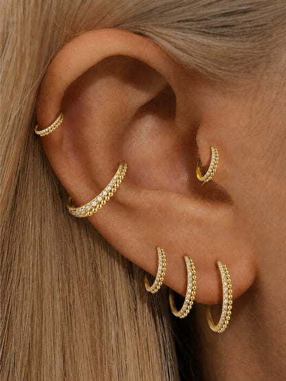 Gold CZ beaded clicker hoop rings styled on ear stack