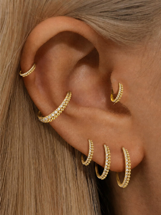 Gold CZ beaded clicker hoop rings styled on ear stack
