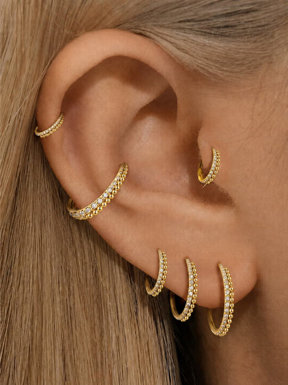 Gold CZ beaded clicker hoop rings styled on ear stack