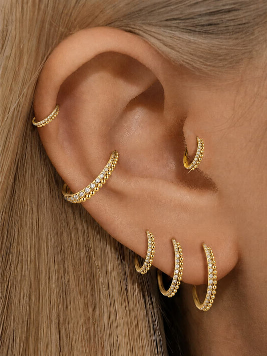 Gold CZ beaded clicker hoop rings styled on ear stack