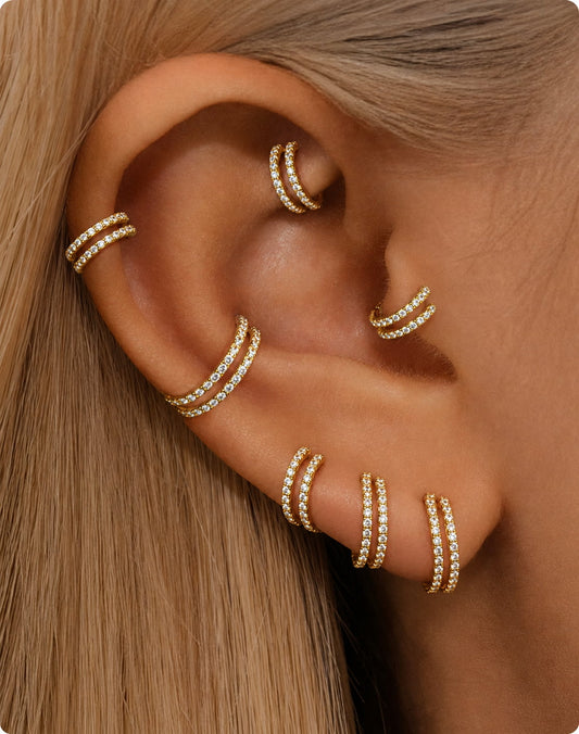 Gold double CZ clicker hoops styled on helix conch lobe and tragus piercings