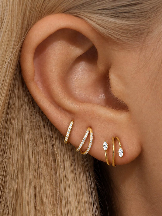 Gold G23 titanium CZ 3-piece ear stack with pavé clicker double hoop and marquise spiral hoop