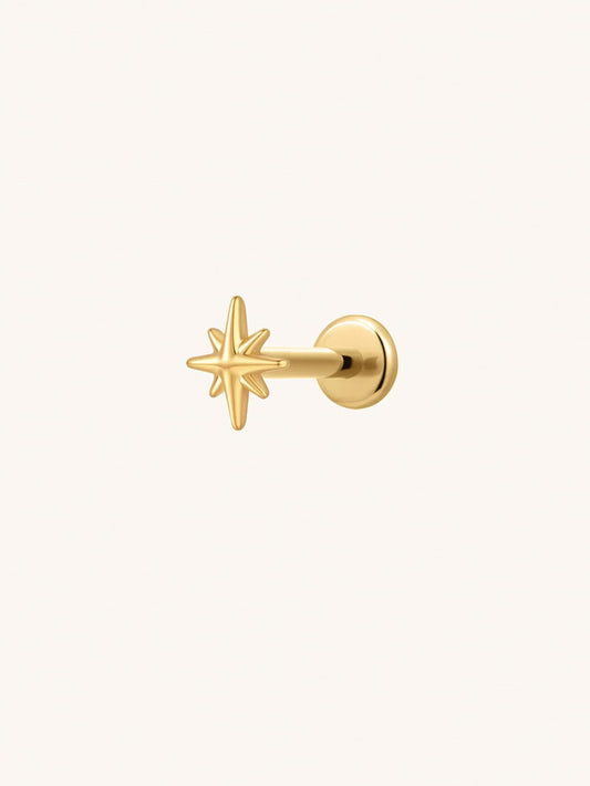 Gold eight point star threadless flat back stud in G23 titanium for cartilage piercings