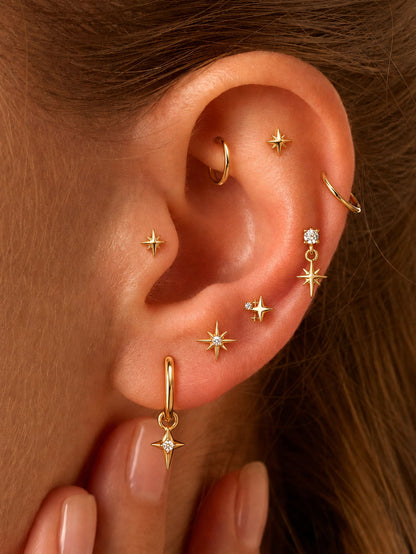 Gold star flat back studs styled on helix lobe and cartilage piercings