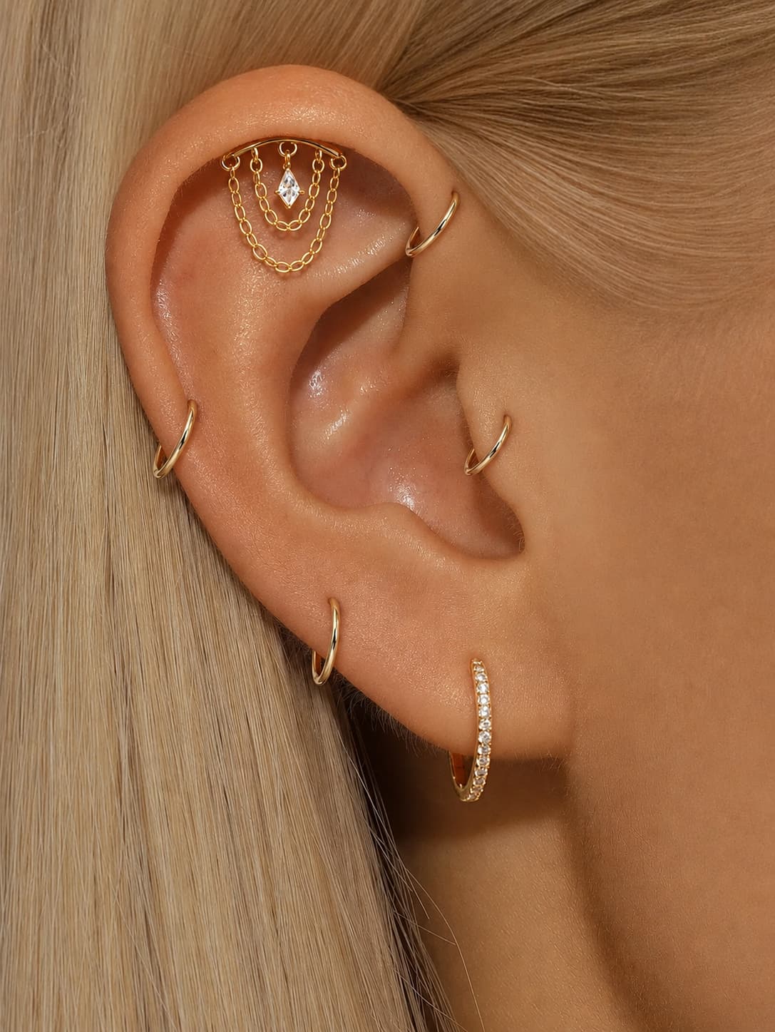 Gold kite crystal chain hidden helix earring worn on upper ear