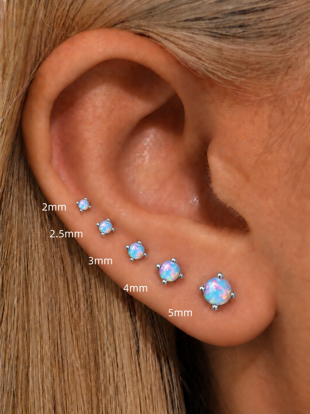 Light blue opal flat back stud size comparison from 2mm to 5mm shown on ear