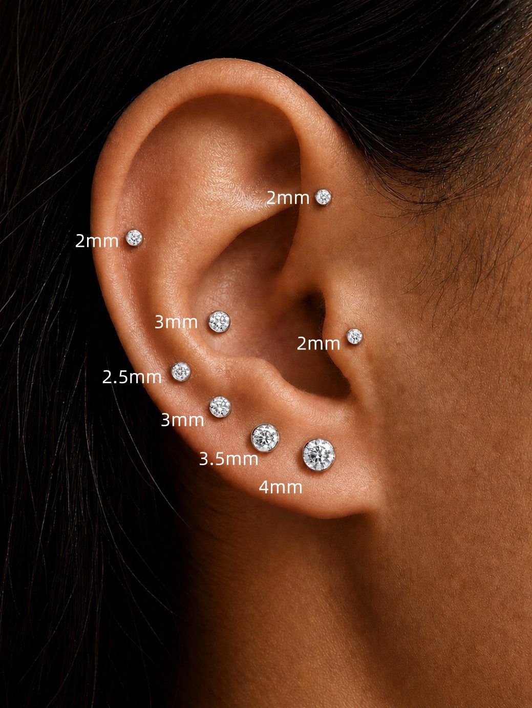 Moissanite sterling silver flat back studs in 2mm 2.5mm 3mm 3.5mm and 4mm sizes styled on the ear