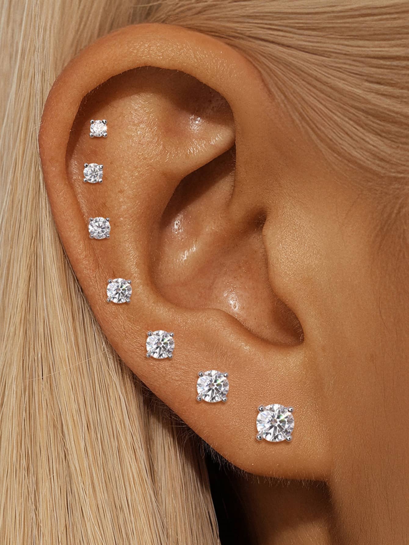 Moissanite flat back studs styled on lobe helix and cartilage piercings