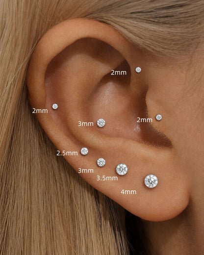 Moissanite 925 sterling silver flat back stud size guide showing 2mm 2.5mm 3mm 3.5mm and 4mm on the ear