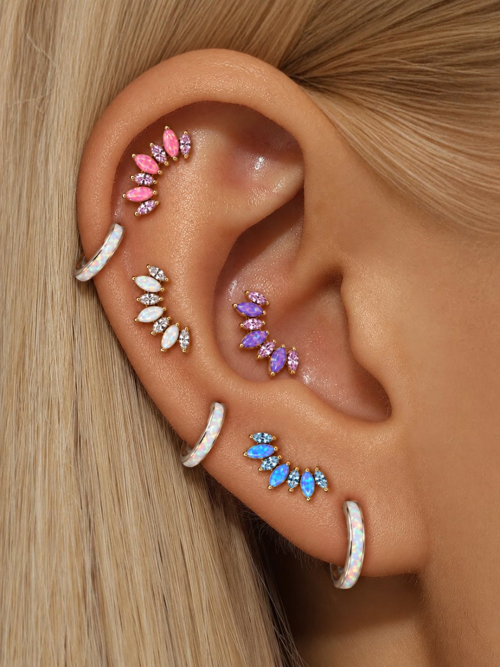 Opal cluster flat back studs styled on multiple ear piercings in pink, purple, white and blue