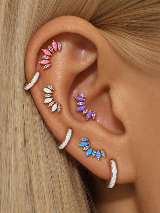 Opal cluster flat back studs styled on multiple ear piercings in pink, purple, white and blue