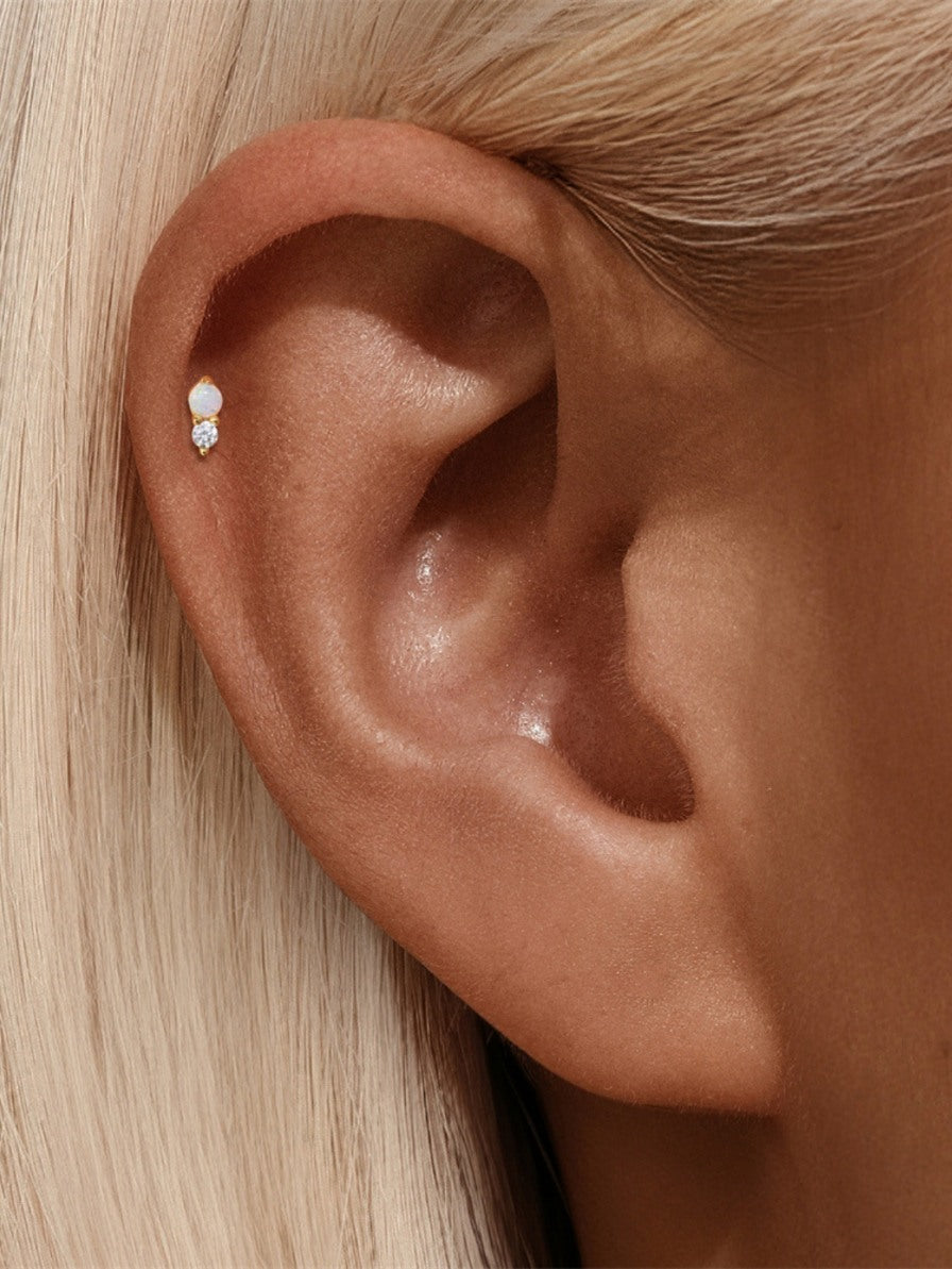 Opal and CZ flat back earring worn on helix piercing