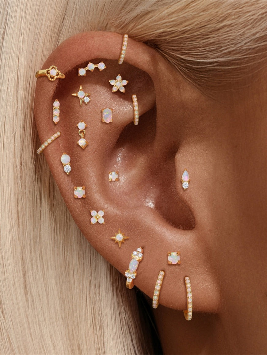 925 sterling silver opal flat back stud earring worn on cartilage piercing