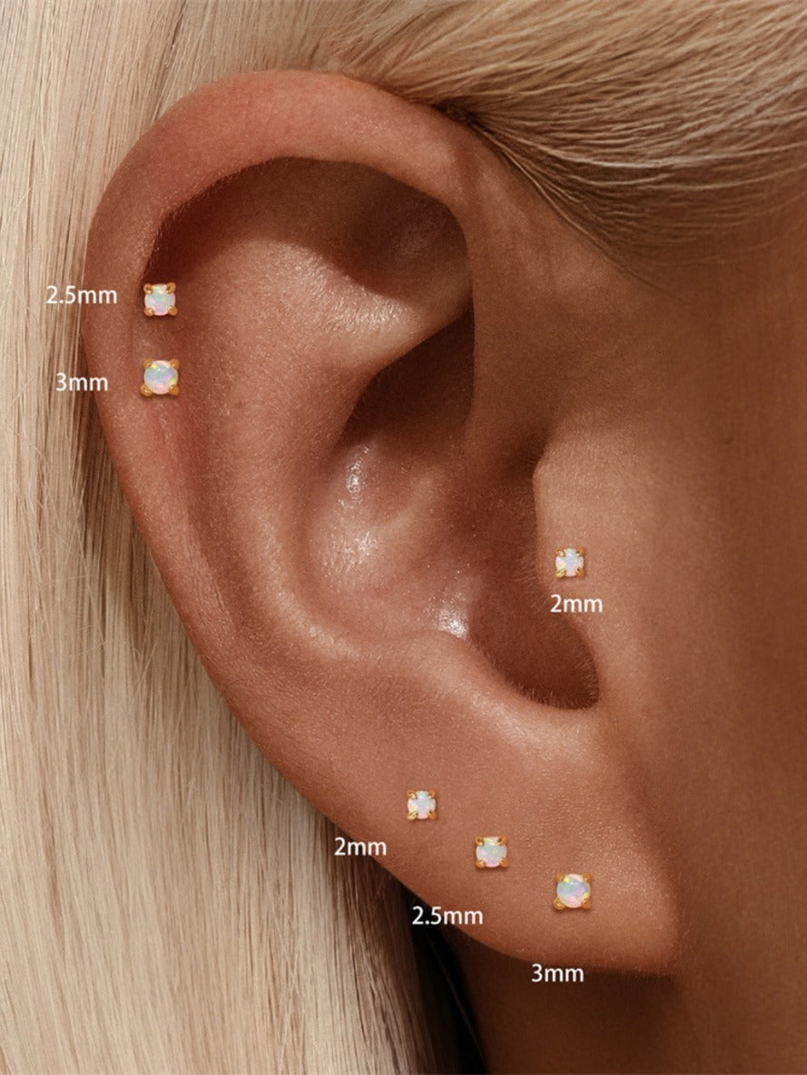925 sterling silver opal flat back stud earrings worn on ear showing 2mm 2.5mm and 3mm sizes