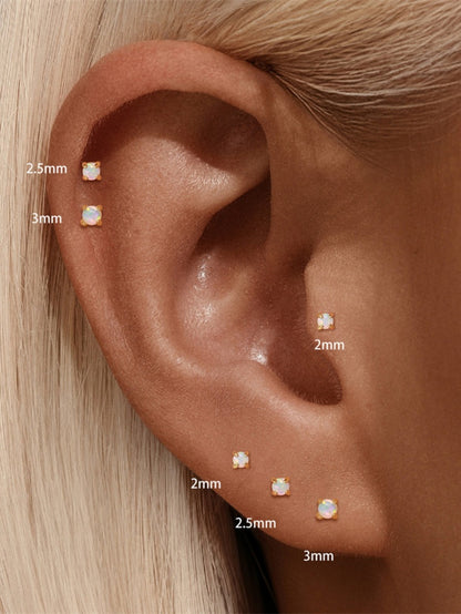 925 sterling silver opal flat back stud earrings worn on ear showing 2mm 2.5mm and 3mm sizes