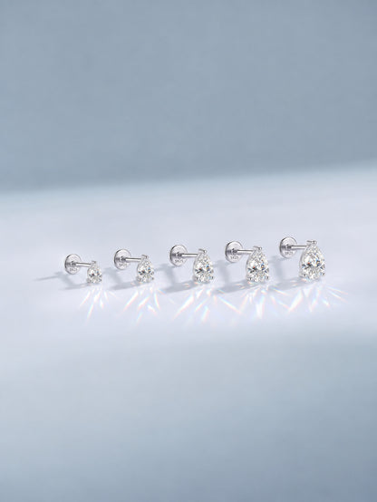 Pear-cut moissanite sterling silver flat back studs in five graduated sizes