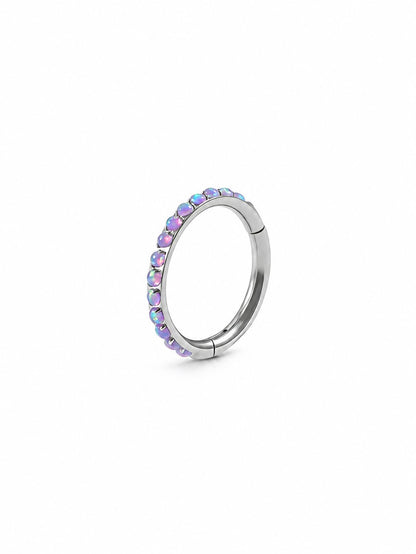 Purple opal titanium clicker rings styled in a cartilage ear stack