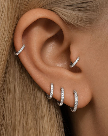 Gold G23 titanium pavé CZ clicker hoops in 8mm, 10mm and 12mm inner diameters with 18G straight posts.