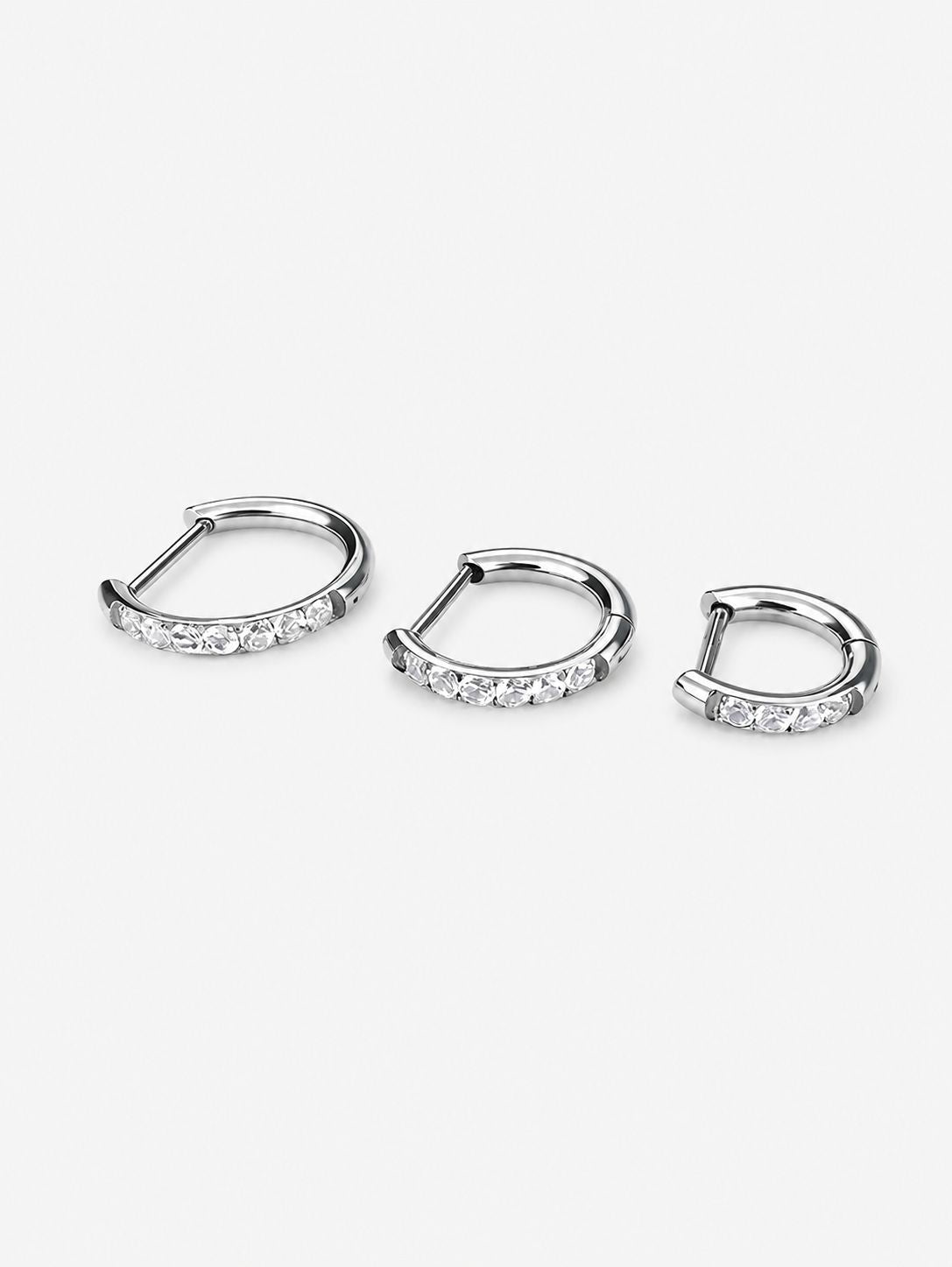 Silver G23 titanium pavé CZ clicker hoops displayed in 8mm, 10mm and 12mm inner diameters.