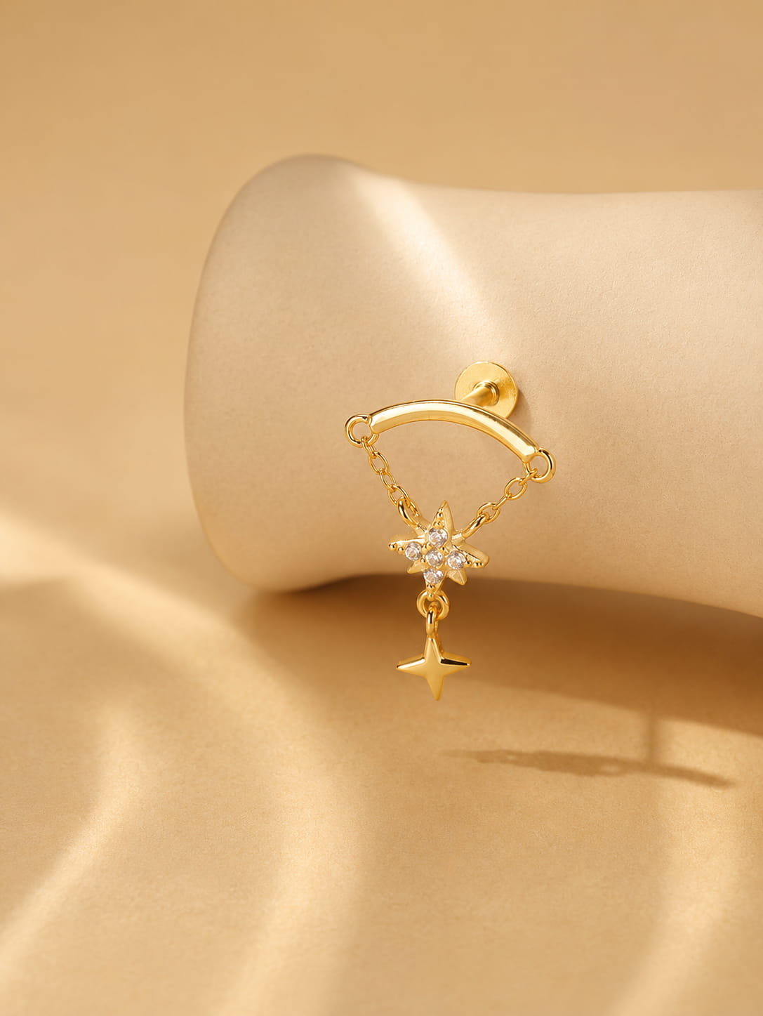 925 sterling silver star dangle hidden helix stud in a gold tone finish