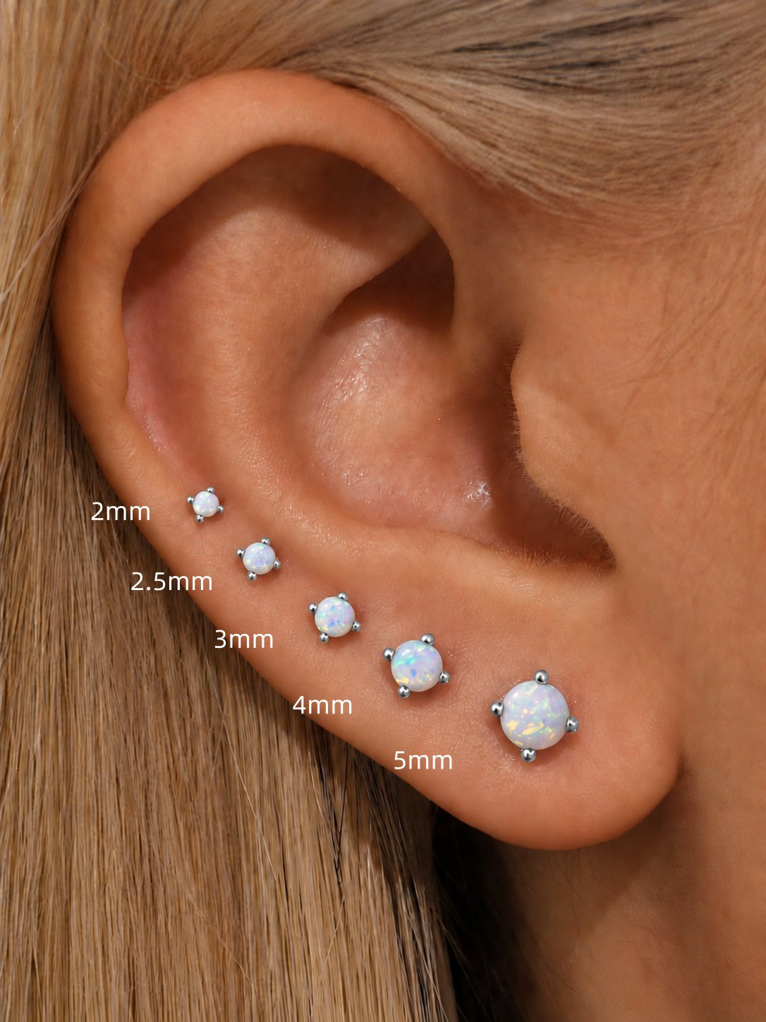 White opal flat back stud size comparison from 2mm to 5mm shown on ear